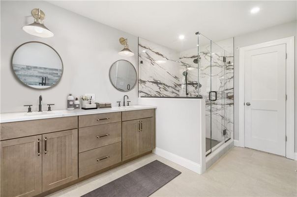 Bathroom, Dual Sink Vanities, Glass Shower, Interior, Marble Walls, Recessed Lighting