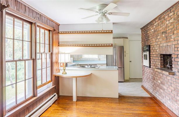 Fireplace, Interior, Kitchen, Stainless Steel Appliances, Stone Walls, Wood Texture Flooring