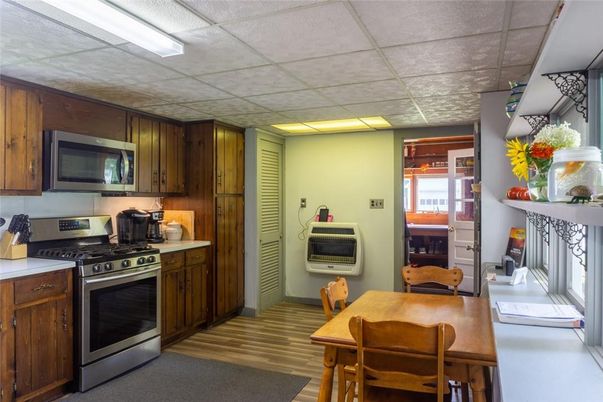 Dining room, Interior, Kitchen, Recessed Lighting, Stainless Steel Appliances, Wood Texture Flooring