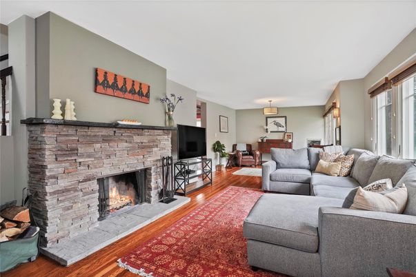 Dining room, Fireplace, Interior, Living room, Pendant Lights, Stone Walls, Wood Texture Flooring