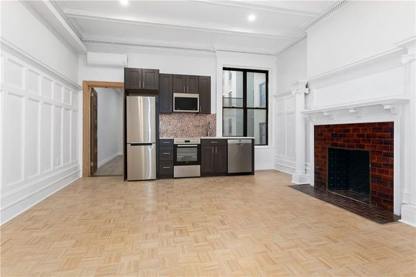 Fireplace, Interior, Kitchen, Recessed Lighting, Stainless Steel Appliances, Stone Walls, Wood Texture Flooring