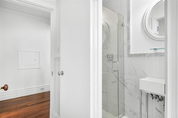 Bathroom, Glass Shower, Interior, Marble Walls, Wood Texture Flooring
