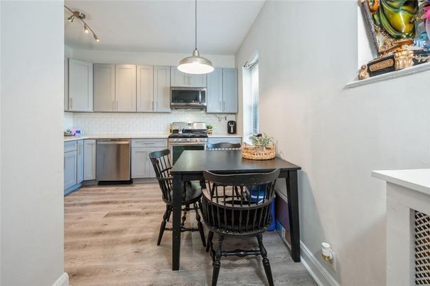 Dining room, Interior, Kitchen, Pendant Lights, Stainless Steel Appliances, Wood Texture Flooring