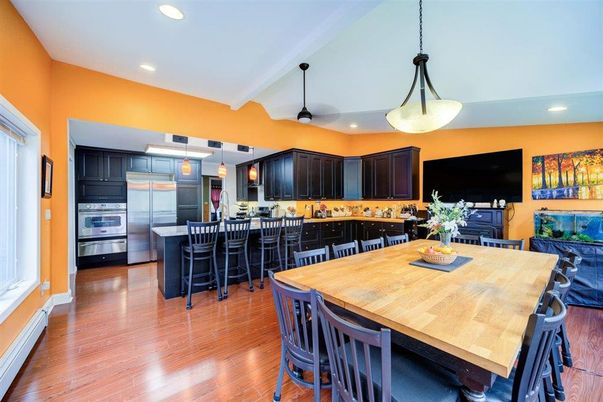 Dining room, Interior, Kitchen, Pendant Lights, Recessed Lighting, Stainless Steel Appliances, Wood Texture Flooring
