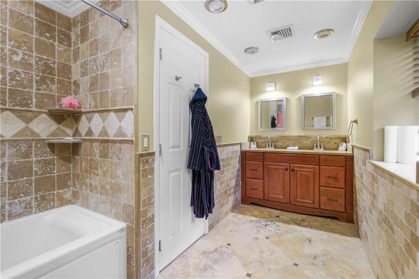 Bathroom, Dual Sink Vanities, Interior, Recessed Lighting, Stone Walls