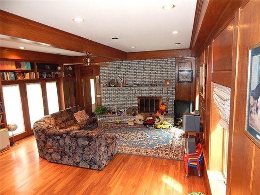 Fireplace, Interior, Living room, Recessed Lighting, Stone Walls, Wood Texture Flooring
