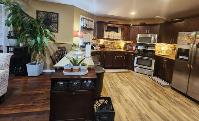 Dining room, Interior, Kitchen, Recessed Lighting, Stainless Steel Appliances, Wood Texture Flooring