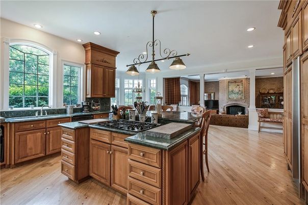 Chandelier, Dining room, Fireplace, Interior, Kitchen, Living room, Pendant Lights, Recessed Lighting, Stone Walls, Wood Texture Flooring