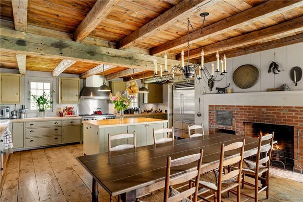 Chandelier, Dining room, Fireplace, Interior, Kitchen, Pendant Lights, Stainless Steel Appliances, Stone Walls, Wooden Beams, Wooden Ceilings, Wood Texture Flooring