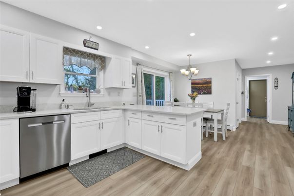 Chandelier, Dining room, Interior, Kitchen, Recessed Lighting, Stainless Steel Appliances, Wood Texture Flooring