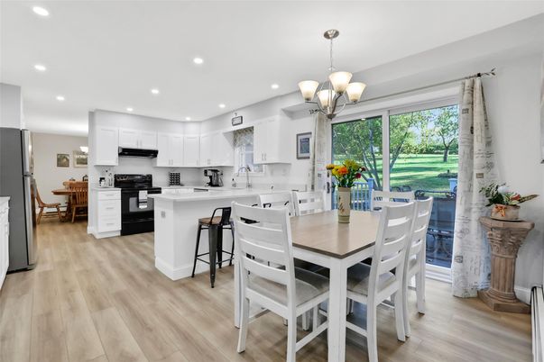 Chandelier, Dining room, Interior, Kitchen, Pendant Lights, Recessed Lighting, Stainless Steel Appliances, Wood Texture Flooring