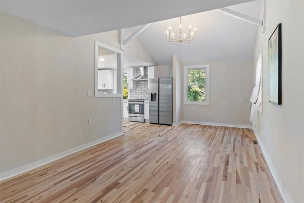 Empty room, Interior, Kitchen, Pendant Lights, Stainless Steel Appliances, Wood Texture Flooring