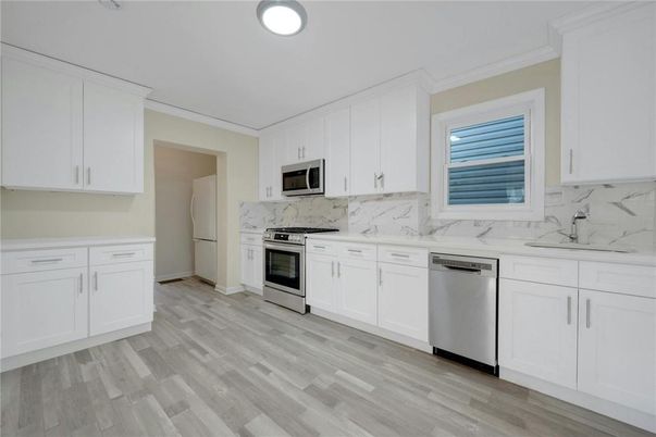 Interior, Kitchen, Marble Walls, Stainless Steel Appliances, Wood Texture Flooring