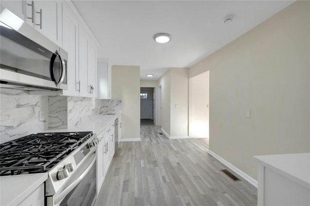 Interior, Kitchen, Marble Walls, Recessed Lighting, Wood Texture Flooring
