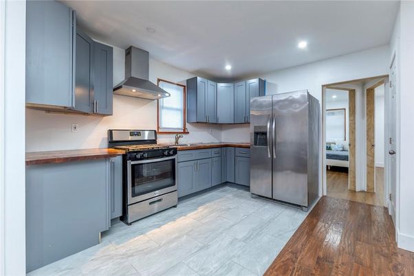 Interior, Kitchen, Marble, Recessed Lighting, Stainless Steel Appliances, Wood Texture Flooring