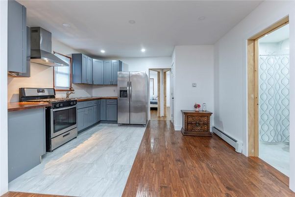 Interior, Kitchen, Marble, Recessed Lighting, Stainless Steel Appliances, Wood Texture Flooring