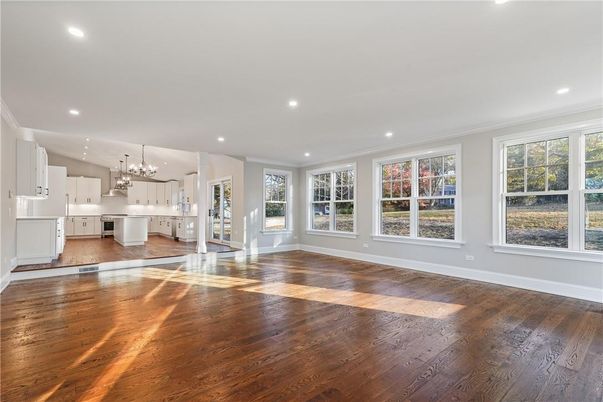 Chandelier, Empty room, Interior, Kitchen, Recessed Lighting, Stainless Steel Appliances, Wood Texture Flooring