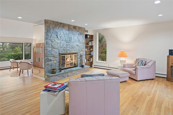 Dining room, Fireplace, Interior, Living room, Recessed Lighting, Stone Walls, Wood Texture Flooring