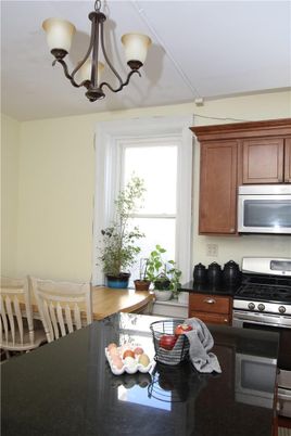 Chandelier, Dining room, Interior, Kitchen, Stainless Steel Appliances, Wood Texture Flooring