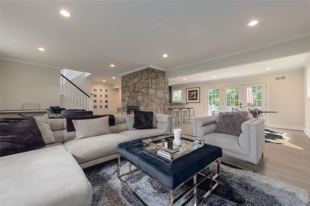 Fireplace, Interior, Living room, Recessed Lighting, Stone Walls, Wood Texture Flooring