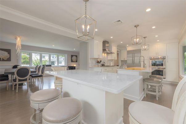 Chandelier, Dining room, Interior, Kitchen, Pendant Lights, Recessed Lighting, Stainless Steel Appliances, Wood Texture Flooring
