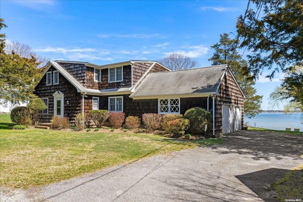 Attached, Exterior, Facade, Water, Tudor Revival
