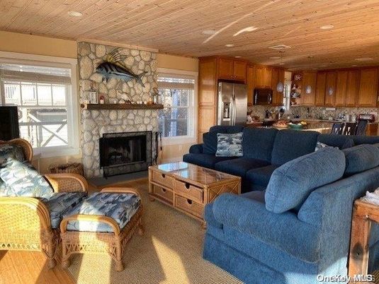 Dining room, Fireplace, Interior, Kitchen, Living room, Recessed Lighting, Stainless Steel Appliances, Stone Walls, Wooden Ceilings