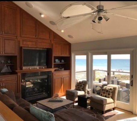 Fireplace, Interior, Living room, Recessed Lighting, Water, Wooden Walls