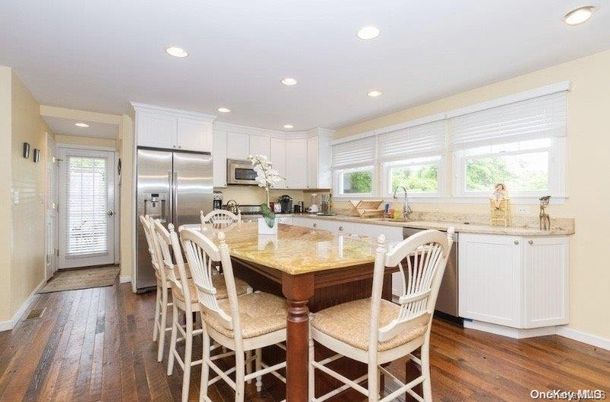 Dining room, Interior, Kitchen, Recessed Lighting, Stainless Steel Appliances, Wood Texture Flooring