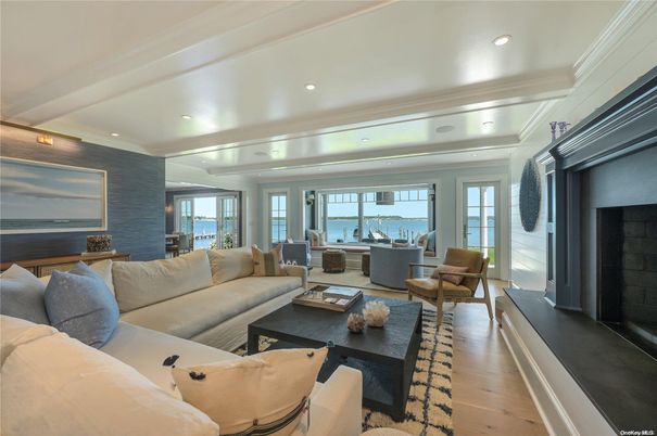 Dining room, Fireplace, Interior, Living room, Recessed Lighting, Water, Wood Texture Flooring