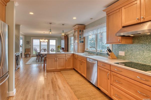 Chandelier, Dining room, Interior, Kitchen, Pendant Lights, Recessed Lighting, Stainless Steel Appliances, Wood Texture Flooring