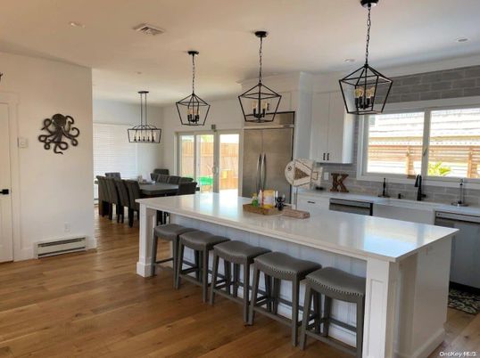 Dining room, Interior, Kitchen, Pendant Lights, Recessed Lighting, Stainless Steel Appliances, Wood Texture Flooring