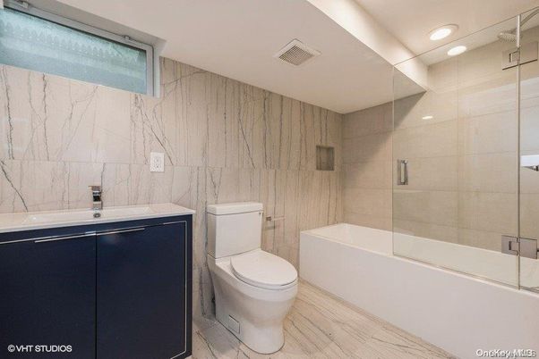 Bathroom, Glass Shower, Interior, Marble Walls, Recessed Lighting, Wood Texture Flooring