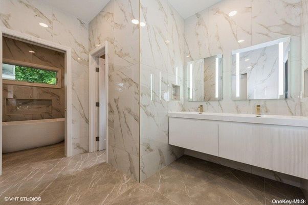 Bathroom, Dual Sink Vanities, Free Standing Baths, Glass Shower, Interior, Marble Walls, Recessed Lighting