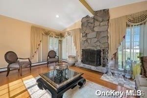 Fireplace, Interior, Living room, Recessed Lighting, Stone Walls, Wood Texture Flooring