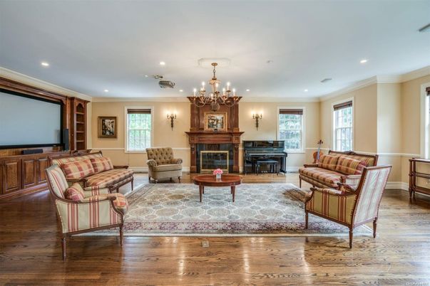 Chandelier, Fireplace, Interior, Living room, Piano, Recessed Lighting, Wood Texture Flooring