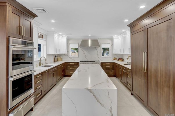 Interior, Kitchen, Marble Walls, Recessed Lighting, Stainless Steel Appliances