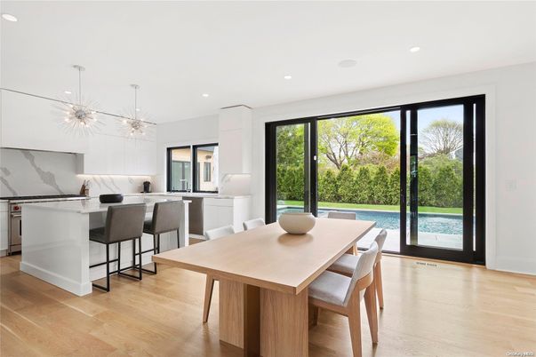 Dining room, Interior, Kitchen, Marble Walls, Pendant Lights, Recessed Lighting, Stainless Steel Appliances, Wood Texture Flooring
