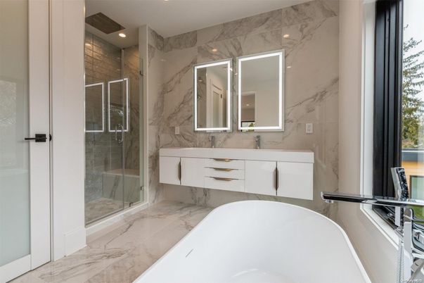 Bathroom, Dual Sink Vanities, Free Standing Baths, Glass Shower, Interior, Marble, Marble Walls, Recessed Lighting