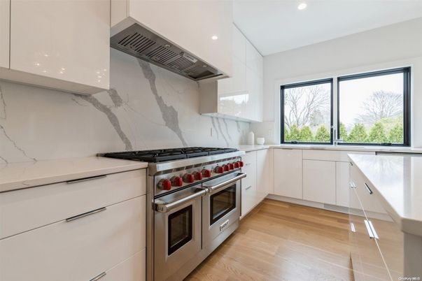 Interior, Kitchen, Marble Walls, Recessed Lighting, Stainless Steel Appliances, Wood Texture Flooring