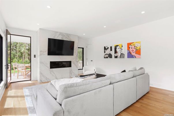 Fireplace, Interior, Living room, Marble Walls, Recessed Lighting, Wood Texture Flooring