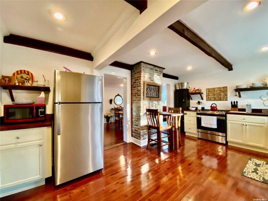 Dining room, Interior, Kitchen, Recessed Lighting, Stainless Steel Appliances, Stone Walls, Wooden Beams, Wood Texture Flooring