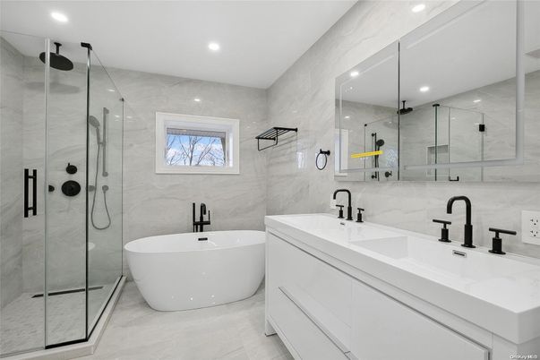 Bathroom, Dual Sink Vanities, Free Standing Baths, Glass Shower, Interior, Marble, Marble Walls, Recessed Lighting