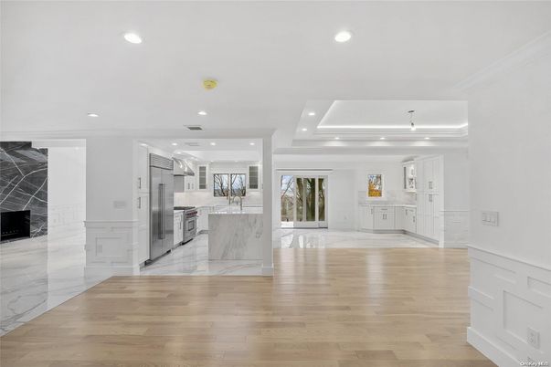 Interior, Kitchen, Marble, Marble Walls, Recessed Lighting, Stainless Steel Appliances, Wood Texture Flooring