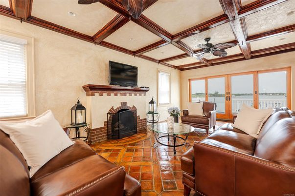 Fireplace, Interior, Living room, Recessed Lighting, Water, Wooden Beams