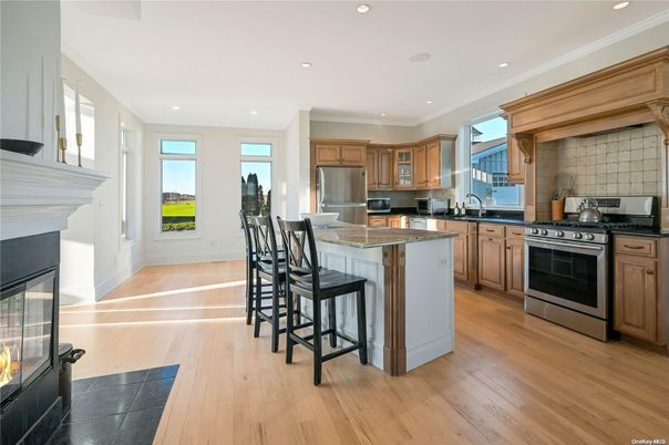 Fireplace, Interior, Kitchen, Recessed Lighting, Stainless Steel Appliances, Wood Texture Flooring