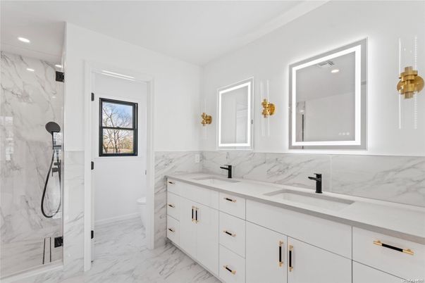 Bathroom, Dual Sink Vanities, Interior, Marble, Marble Walls, Recessed Lighting