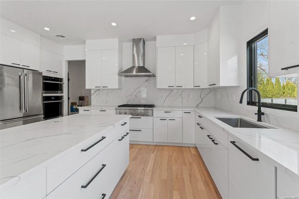 Interior, Kitchen, Marble Walls, Recessed Lighting, Stainless Steel Appliances, Wood Texture Flooring
