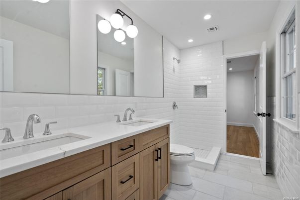 Bathroom, Dual Sink Vanities, Interior, Recessed Lighting, Wood Texture Flooring