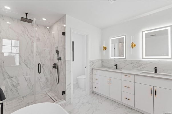 Bathroom, Dual Sink Vanities, Free Standing Baths, Glass Shower, Interior, Marble, Marble Walls, Recessed Lighting